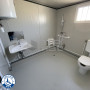 Sanitaire PMR raccordable neuf avec WC , Douche et Lavabo PMR- vue de l'intérieure de côté 1
